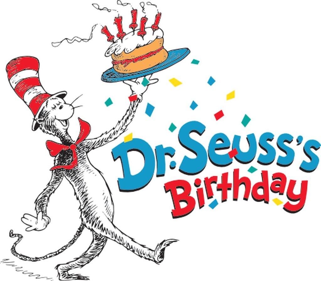 Dr. Suess holding a birthday cake