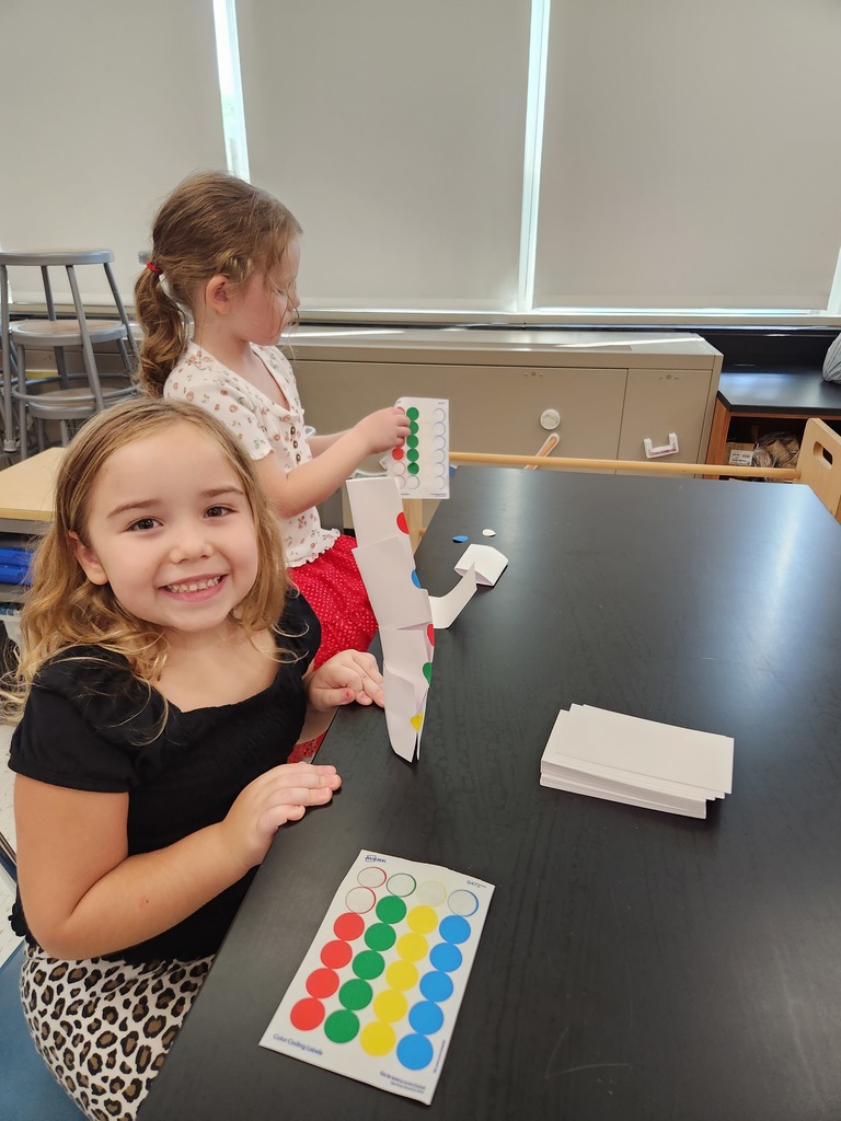 Student building a dot tower