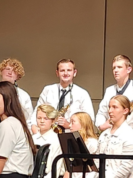 Freshman Christian Morello on stage in the concert band at JHAAS in Akron, NY  