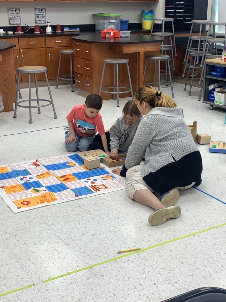 students learning to code with robots